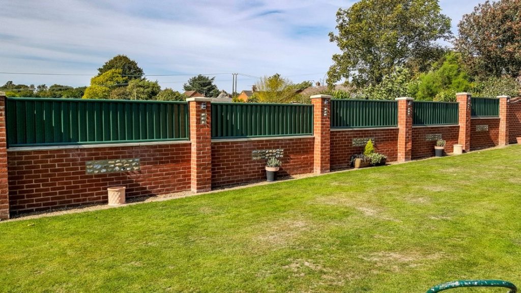 fence on top of wall