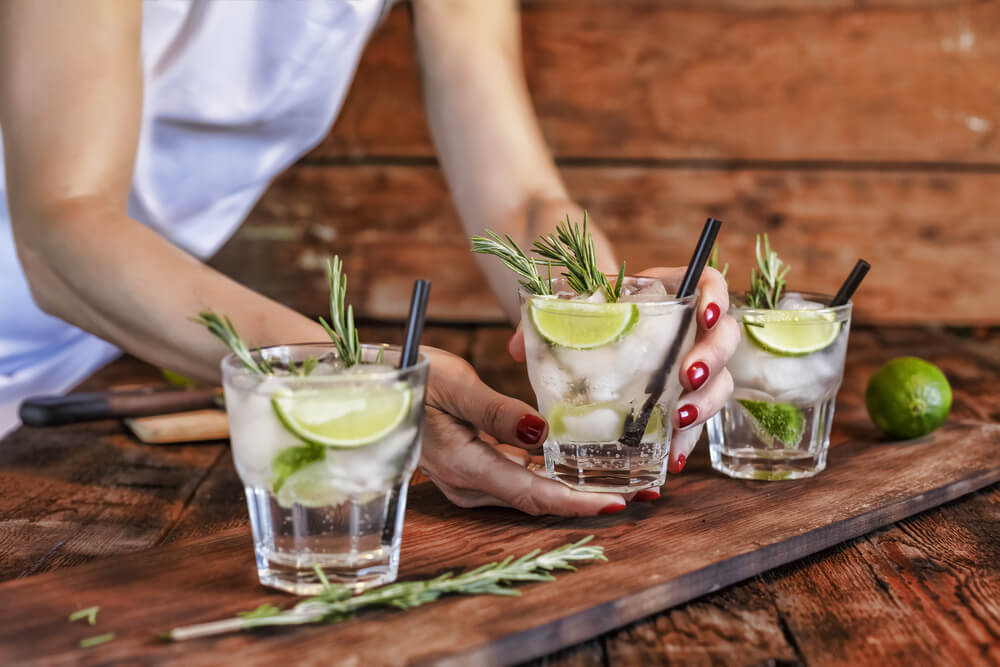 Cocktails with sprigs of herbs